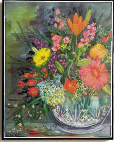 A crystal vase with colorful flowers