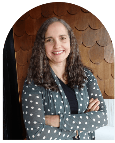 Paula Fontenelle, licensed professional counselor and therapist in Oregon, smiling with arms crossed