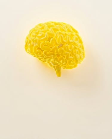 A vibrant 3D yellow human brain model illustrating cognitive function and mental health concepts.