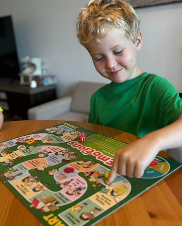 a boy playing a board game with a board game
