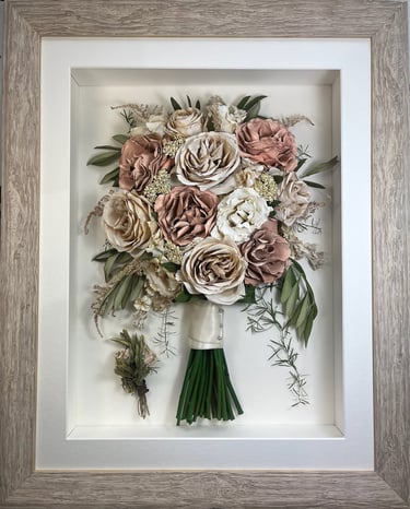 a side view preserved wedding bouquet of soft pink and ivory roses