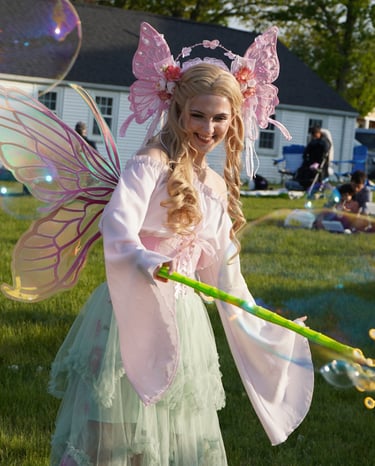 Bubble fairy smiling making bubbles