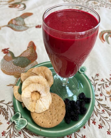 beetroot yoghurt drink on plate with dried fruit on a tablecloth with a chicken design