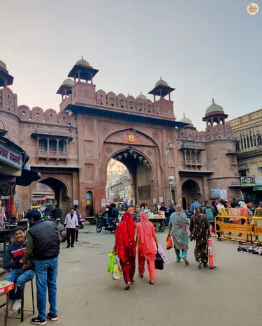 Street view of Kote Gate Bazaar in Bikaner, lined with traditional shops and local crowds.