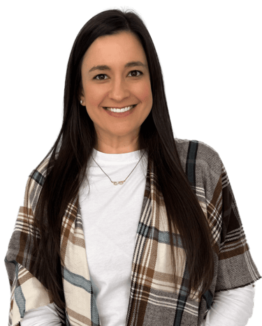 woman with long dark hair wearing a white shirt and plaid scarf