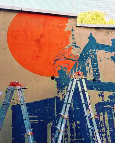 Detail of a mural featuring a large orange sun and blue architecture, created by Poliops using stenc