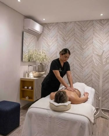 a woman getting a massage at a spa
