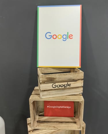 A welcome sign with Google atop Google-branded crates