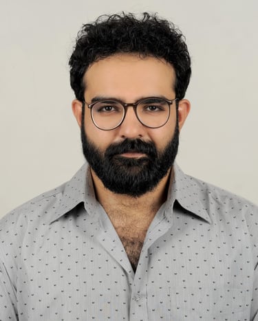 a man with a beard and glasses on a white background