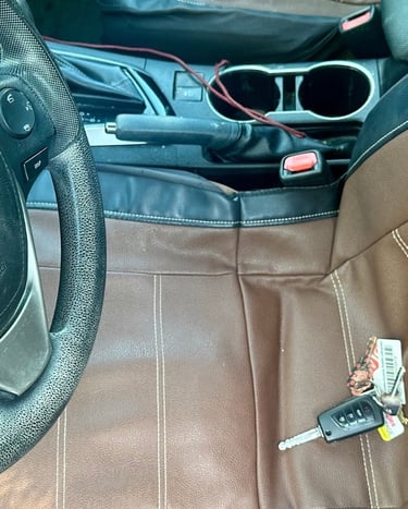Car key locked inside of vehicle on seat—  representing emergency locksmith by Asheville Locksmith Now 