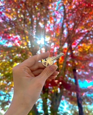 Metal car key duplication with fall tree in background in Canton, NC