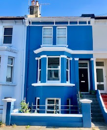 Exterior house painting in Brighton and Hove Sussex, blue rendered facade with white trim