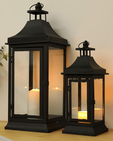 two tall vintage candle lanterns in black