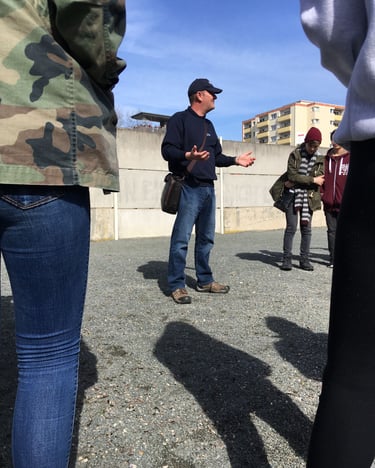 Andrew White at the Berlin Wall memorial talking about the Cold War and the division of Berlin