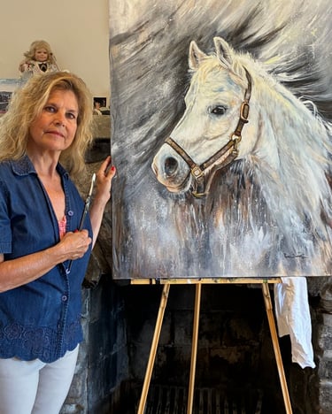 “Artist Renee Dumont pictured with Felix’s memorial horse portrait.”