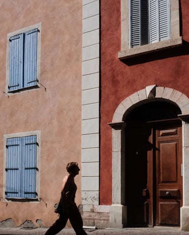 a woman walking down a shiny street