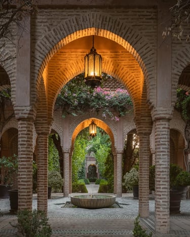 Lantern-lit Moorish colonnade with tiled floor and inner fountain