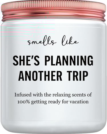 Candle that says it smells like she's planning another trip