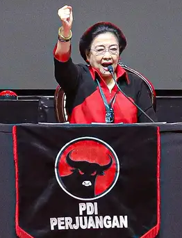a woman in a red jacket and a microphone, Megawati Soekarnoputri