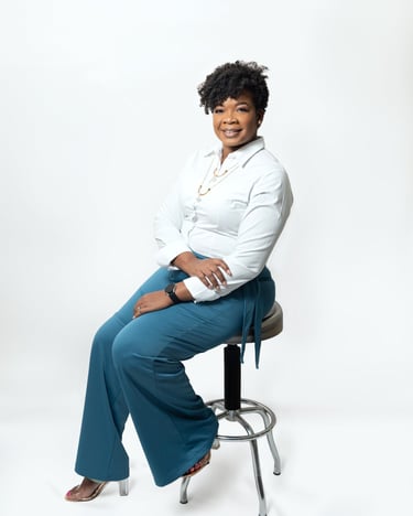 a business woman sitting on a stool