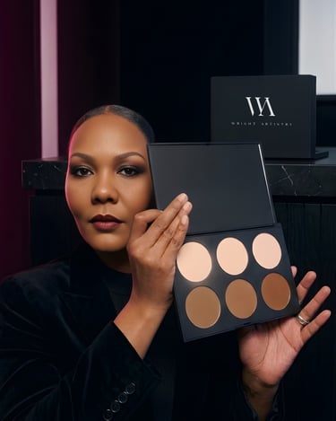 A makeup artist holding a professional Wright Artistry contour and highlight palette with six shades.