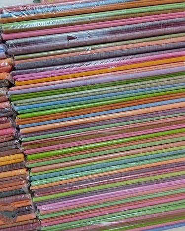 Assorted Colored Mulberry Silk Fabrics Rolled in Bundles β Ready for Weaving and Export from India