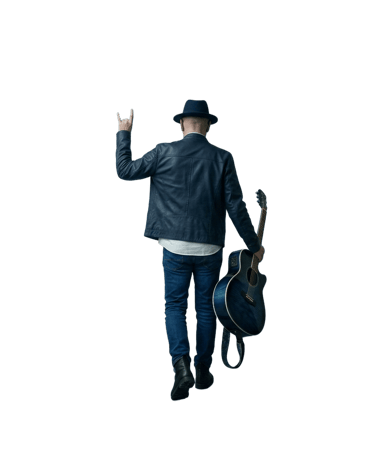 Photo of mANDRAk walking away, taken from his back with an acoustic guitar