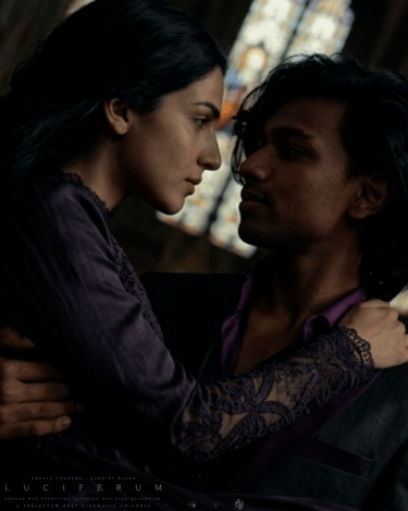 Kesava Chandra as The Raconteur carrying Harriet Blake as Valerina in Luciferum (2031)