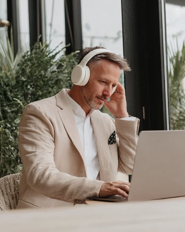 Business Man wearing noise cancelling headphones