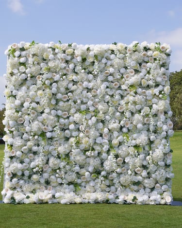 Elegant white rose and peony flower wall backdrop for weddings and events.