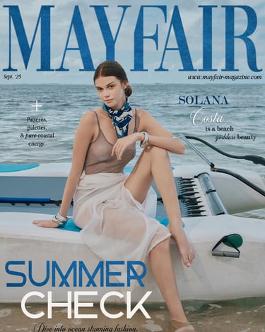 Mayfair Magazine September 2025 cover featuring a model in transparent swimwear seated on a mini catamaran.
