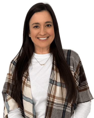 woman with long dark hair wearing a white shirt and plaid scarf
