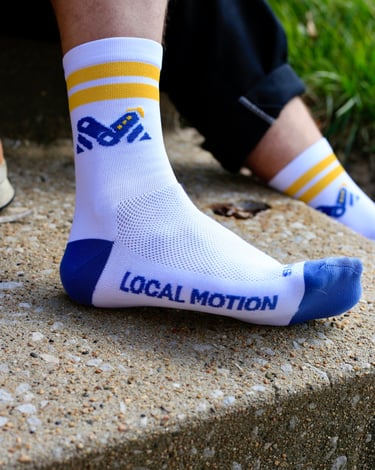 Photo of the side of the Local Motion socks that sport the logo
