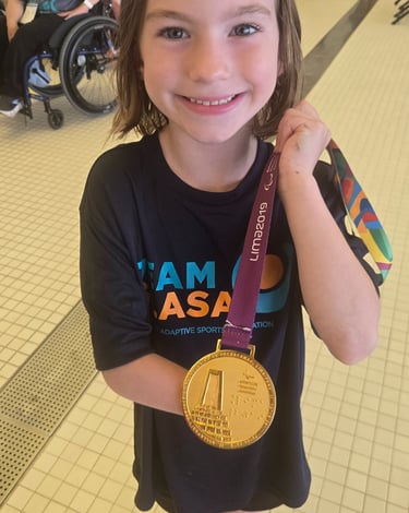 young girl holding a medal