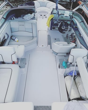 Boat interior before SeaDek flooring upgrade – worn factory deck prior to Vital Marine installation 