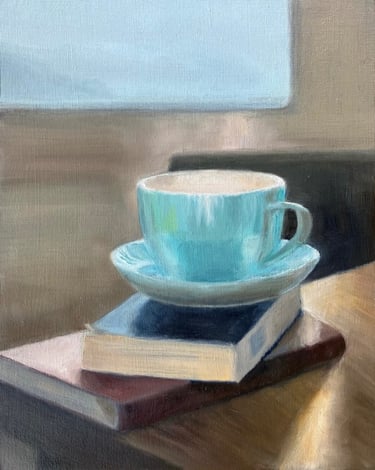 Limited edition giclee print of a cup & saucer on book in front of a sunlit window