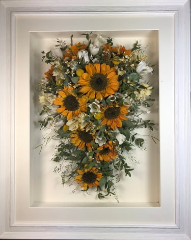 trailing view preserved wedding bouquet with sunflowers in a frame