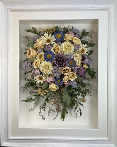 trailing view preserved wedding bouquet with white daisies in a frame