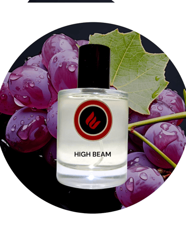 a bottle of high beam perfume with grapes and leaves