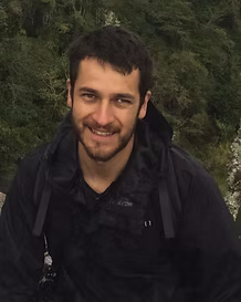 Chiapas birding guide Valente Gonzalez smiling to the camera in front of a jungle background