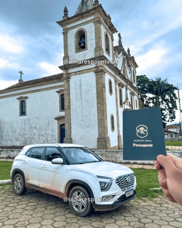 Passaporte da Estrada Real em Glaura MG diante da igreja histórica colonial