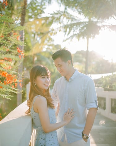 Intimate couple portrait on balcony at Sofitel Bali Nusa Dua Beach Resort during sunset.