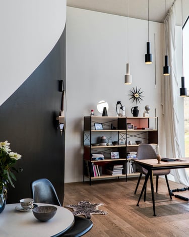a living room with a table and chairs