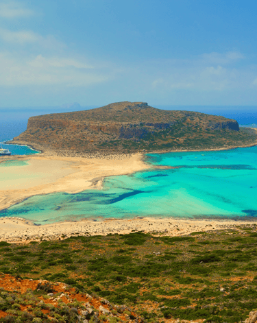 a beach with a boat in the water
