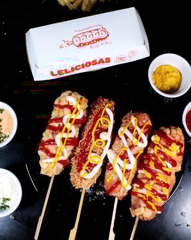 a bunch of food on a table with a box of ketchup