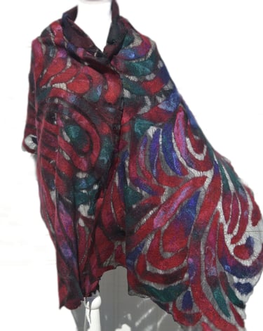 Handmade red and blue nuno felted wool scarf with an abstract swirl pattern on a mannequin.