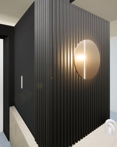 Zoom sur le projet de transformation de l'espace d'entrée avec un mobilier sur mesure noir et bois