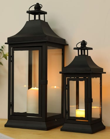 two tall vintage candle lanterns in black