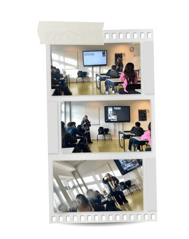 Students in a modern classroom attending a lecture with a teacher and interactive screen.