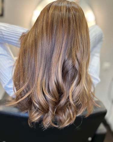 a woman with long hair and a blonde haircut